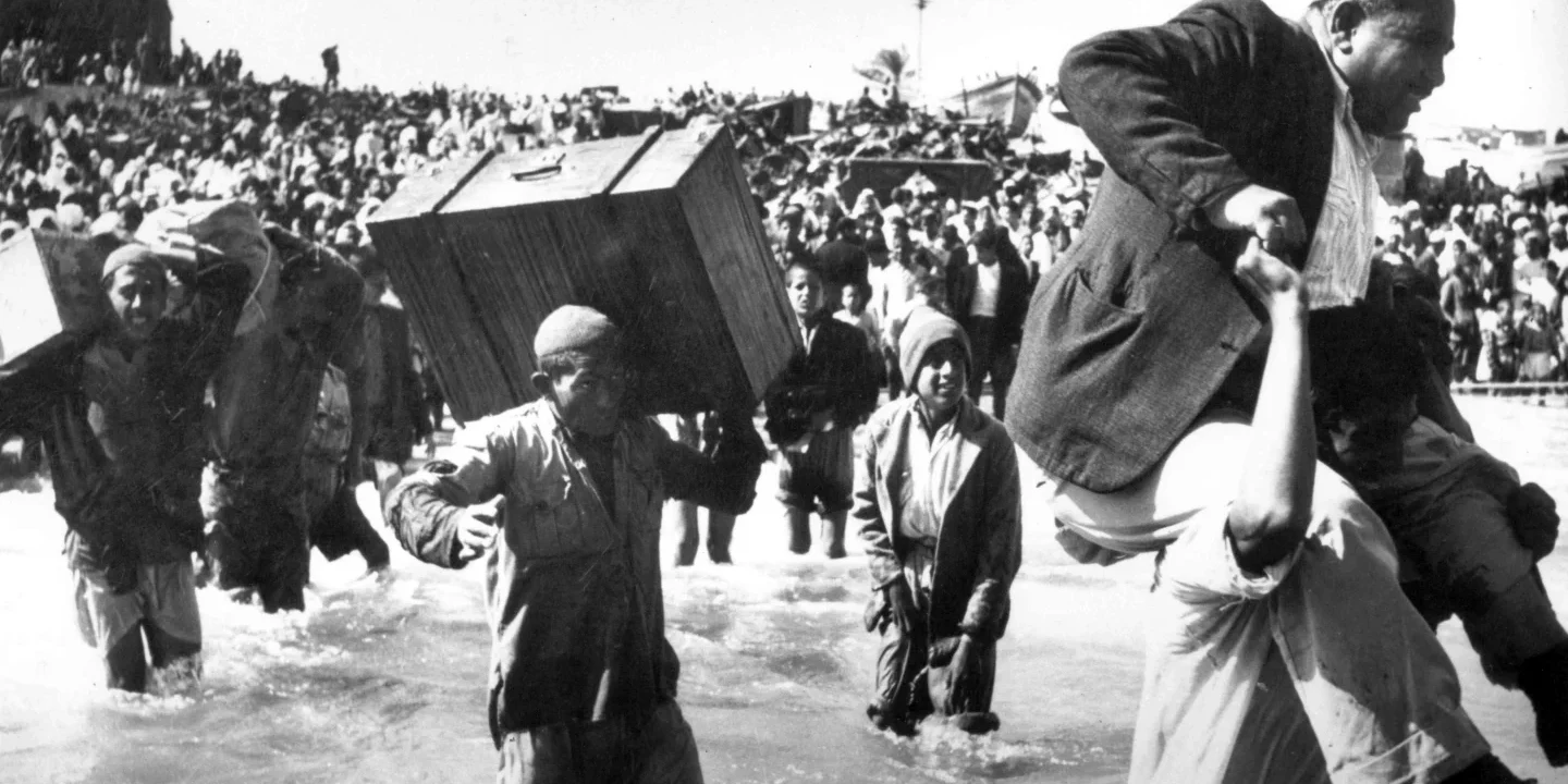 Palestinian refugees displaced to Gaza boarding boats to Lebanon or Egypt in 1949 — a defining image of what is the Nakba