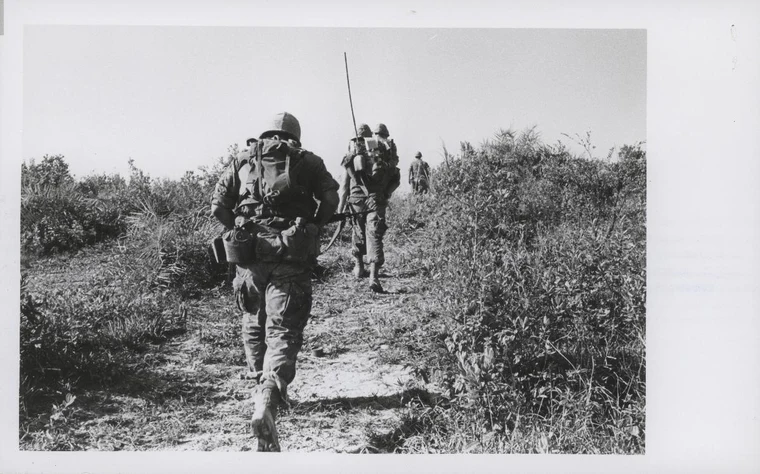 US Marines advancing through rice paddies during a search and destroy mission in the Vietnam War