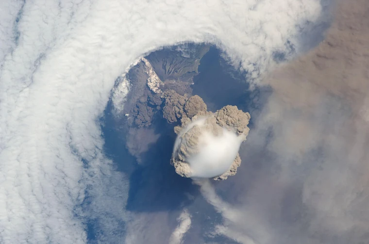 What is plate tectonics? Sarychev Peak volcano erupting in June 2009, photographed from the International Space Station — the volcano sits above a subduction zone in the Pacific Ring of Fire