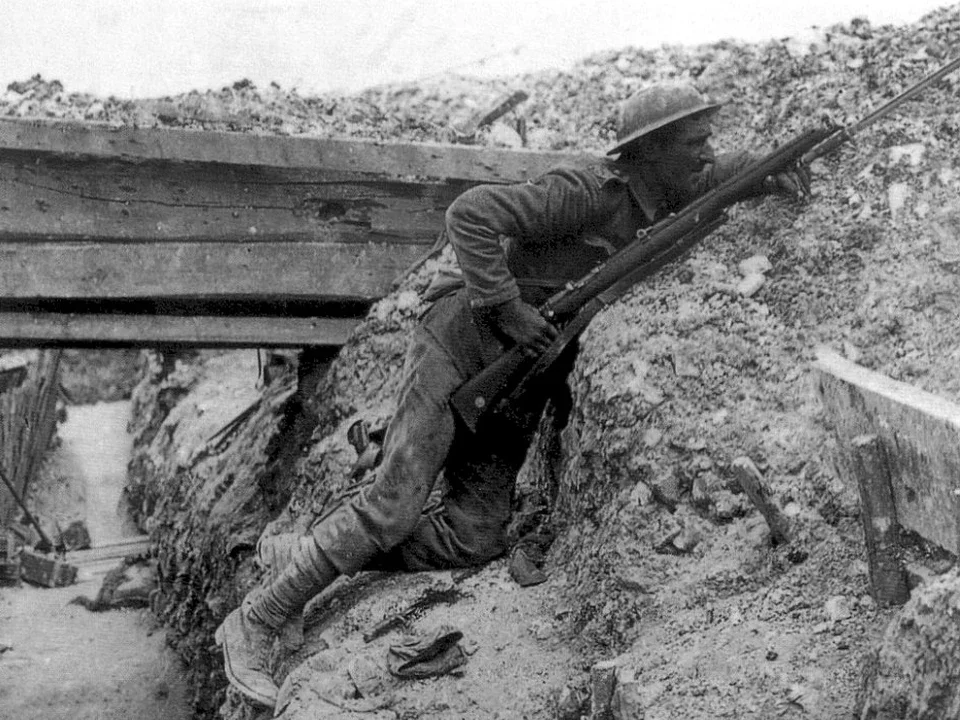 A British soldier of the Cheshire Regiment keeps watch from a trench near La Boisselle during the Battle of the Somme, July 1916